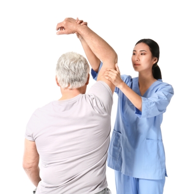A chiropractor evaluating a senior patient’s posture and joint mobility to identify alignment issues that may affect balance and coordination.